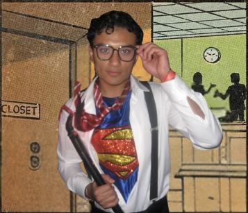 Damian dressed as Superman, holding a prop and adjusting his glasses