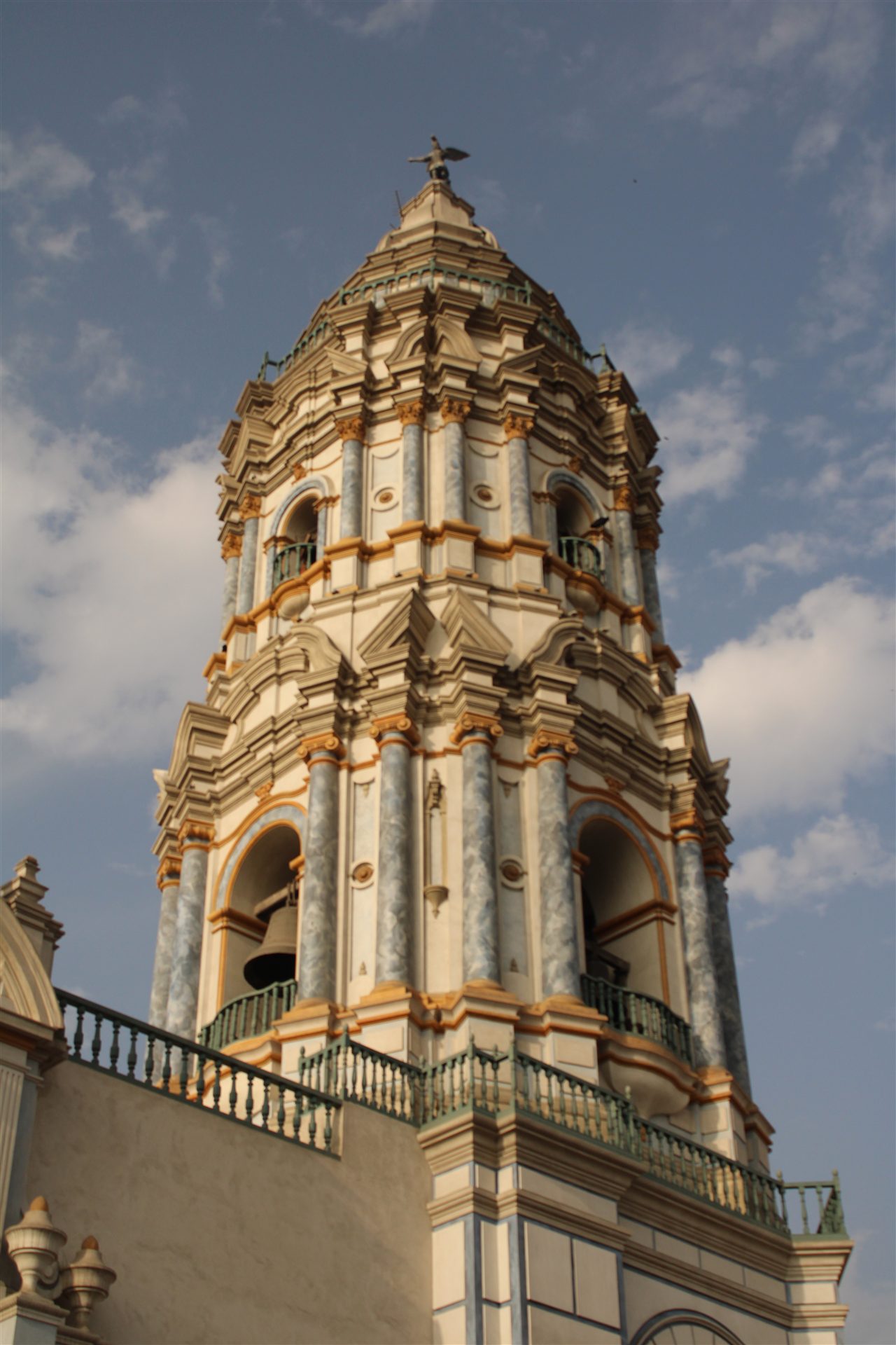 Ornate church tower against a blue sky