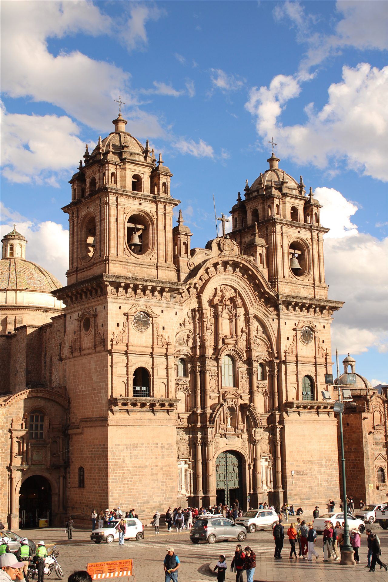 Historic cathedral beneath dramatic clouds in Cusco